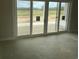 Sliding glass doors leading to the backyard offer ample natural light at Tbd 61 Persimmon Rd., Aynor, SC 29511