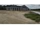 New home exterior with gray siding, black roof, white trim, and a covered front porch at Tbd 61 Persimmon Rd., Aynor, SC 29511