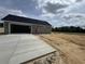 Detached garage and expansive driveway, offering convenience and ample parking for a modern home at Tbd 61 Persimmon Rd., Aynor, SC 29511
