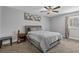 Inviting bedroom features neutral tones, a ceiling fan, and natural light at 10301 N Kings Hwy. # 8-1, Myrtle Beach, SC 29572