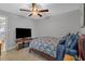 Cozy bedroom with a ceiling fan, and patterned bedding at 10301 N Kings Hwy. # 8-1, Myrtle Beach, SC 29572