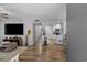 Inviting living room with wood floors, open to kitchen and dining for seamless entertaining at 10301 N Kings Hwy. # 8-1, Myrtle Beach, SC 29572