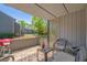 Relaxing covered patio with outdoor furniture and views of the landscaped backyard at 10301 N Kings Hwy. # 8-1, Myrtle Beach, SC 29572