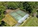 Aerial shot showcases well-maintained tennis courts nestled among lush trees for recreational enjoyment in a community setting at 10301 N Kings Hwy. # 8-1, Myrtle Beach, SC 29572