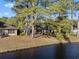 House located next to pond surrounded by mature trees at 111 Cedar Ridge Ln., Conway, SC 29526