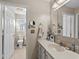 Bathroom with toilet, towel rack, sink, drawers, and well-lit mirror at 111 Cedar Ridge Ln., Conway, SC 29526