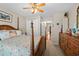 Bedroom featuring a four-poster bed with beach-themed comforter and neutral walls at 111 Cedar Ridge Ln., Conway, SC 29526