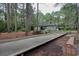 A bocce ball court sits at the end of a wooded walking path at 111 Cedar Ridge Ln., Conway, SC 29526