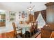 Elegant dining room with classic wood furniture, chandelier, and natural light at 111 Cedar Ridge Ln., Conway, SC 29526