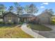 Charming single-story home with inviting walkway, well-manicured lawn and colorful landscaping at 111 Cedar Ridge Ln., Conway, SC 29526