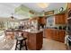 Eat-in kitchen features an island, granite countertops, stainless steel appliances, and views of the backyard at 111 Cedar Ridge Ln., Conway, SC 29526