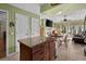 Open kitchen with granite countertops, an island, and views into the Gathering room, perfect for entertaining at 111 Cedar Ridge Ln., Conway, SC 29526