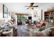 Spacious living room featuring a fireplace, comfortable seating, and a view of the lake at 111 Cedar Ridge Ln., Conway, SC 29526