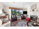 Inviting living room with comfortable seating, a fireplace, and scenic lake views at 111 Cedar Ridge Ln., Conway, SC 29526