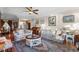 Cozy living room with floral sofas, a view into the foyer, and stylish furnishings at 111 Cedar Ridge Ln., Conway, SC 29526