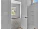 Bathroom shower and adjacent bedroom with a large window providing backyard view at 1222 Nw Calabash Station Blvd., Calabash, NC 28467