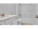 Clean bathroom featuring a white vanity with elegant bronze fixtures and a shower-tub combination at 1222 Nw Calabash Station Blvd., Calabash, NC 28467
