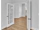 Versatile bonus room featuring beautiful hardwood flooring and elegant glass French doors at 1222 Nw Calabash Station Blvd., Calabash, NC 28467