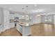 Modern kitchen features stainless appliances, granite countertops, and hardwood floors at 1222 Nw Calabash Station Blvd., Calabash, NC 28467
