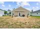 Backyard features patio with outdoor seating and grill and minimal landscaping at 115 Foxford Dr., Conway, SC 29526