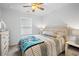 Bright bedroom featuring a comfy bed, ceiling fan, and soft natural lighting at 115 Foxford Dr., Conway, SC 29526