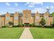 The stately clubhouse features manicured landscaping and a walkway to the front entrance at 115 Foxford Dr., Conway, SC 29526