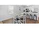 Charming dining area with modern table setting next to kitchen counter and window at 115 Foxford Dr., Conway, SC 29526