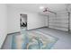 Spacious garage with epoxy flooring and door to adjacent room at 115 Foxford Dr., Conway, SC 29526