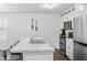 Bright kitchen featuring stainless steel appliances, an island with a sink, and white cabinetry at 115 Foxford Dr., Conway, SC 29526