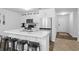 Well-appointed kitchen featuring white cabinets, stainless steel appliances, and marble countertops with bar stool seating at 115 Foxford Dr., Conway, SC 29526