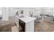 Bright and airy living area with a view of the kitchen, dining space, and a comfortable seating area at 115 Foxford Dr., Conway, SC 29526