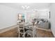 Open living and dining area with a comfortable sectional sofa and elegant dining set at 115 Foxford Dr., Conway, SC 29526