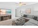 Bright living room with a comfortable sectional sofa, entertainment center with a large TV, and neutral carpeting at 115 Foxford Dr., Conway, SC 29526