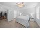 Serene main bedroom with a ceiling fan, neutral carpet, white furniture, and an ensuite bathroom at 115 Foxford Dr., Conway, SC 29526