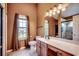 Bathroom featuring a vanity with sink, large mirror, and a glass-enclosed shower at 1154 Lampwick Ln., Murrells Inlet, SC 29576