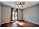 Neutral bedroom with a window and hardwood floors, offering a calm and relaxing space at 1154 Lampwick Ln., Murrells Inlet, SC 29576