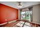 Sunlit bedroom with a large window, hardwood floors, and a neutral color scheme at 1154 Lampwick Ln., Murrells Inlet, SC 29576