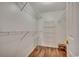 Organized walk-in closet with ample shelving and wooden floors at 1154 Lampwick Ln., Murrells Inlet, SC 29576