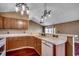 Well-lit kitchen featuring marble countertops, tiled backsplash, and modern lighting fixtures at 1154 Lampwick Ln., Murrells Inlet, SC 29576