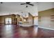 Spacious living room with hardwood floors, ceiling fans, and open access to the kitchen at 1154 Lampwick Ln., Murrells Inlet, SC 29576