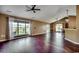 Expansive living room with hardwood floors, large windows, and a sliding glass door at 1154 Lampwick Ln., Murrells Inlet, SC 29576