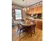 Cozy dining area with wood floors, a wooden table, and bright natural light at 116 Green Lake Dr., Myrtle Beach, SC 29572