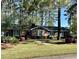 Attractive brick home with mature trees, well-kept lawn, and a cozy, inviting atmosphere at 116 Green Lake Dr., Myrtle Beach, SC 29572
