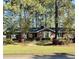 Traditional brick home with manicured lawn, flowering shrubs, and inviting curb appeal at 116 Green Lake Dr., Myrtle Beach, SC 29572