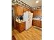 Kitchen showcasing wood cabinets, a white refrigerator, and durable flooring at 116 Green Lake Dr., Myrtle Beach, SC 29572
