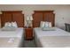 Cozy bedroom featuring two beds with decorative headboards and a shared nightstand at 1200 N Ocean Blvd. N # 905, Myrtle Beach, SC 29577