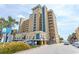 A striking exterior view of the Holiday Pavilion Resort on a bright, sunny day near the beach at 1200 N Ocean Blvd. N # 905, Myrtle Beach, SC 29577