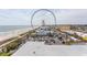 Picturesque aerial view of the Ferris wheel, beach, and cityscape, showcasing the property's location at 1200 N Ocean Blvd. N # 905, Myrtle Beach, SC 29577