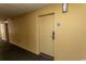 Hotel hallway with the door to unit 905, painted with neutral earth tone colors at 1200 N Ocean Blvd. N # 905, Myrtle Beach, SC 29577