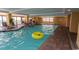 Indoor pool area featuring comfortable seating, shallow depths, and beautiful blue water at 1200 N Ocean Blvd. N # 905, Myrtle Beach, SC 29577